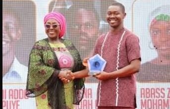 Mr Vanderpuye (right) receiving his award from Ms Gomashie