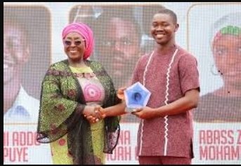 Mr Vanderpuye (right) receiving his award from Ms Gomashie