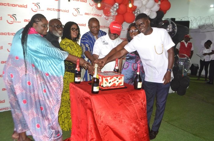 • Dr Lartey (third from left) being assisted by Mr Nkaw (third from right) and other dignitaries to cut the anniversary cake Photo: Victor A. Buxton