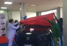 • Mahesh P.K (left) unveiling one of the vehicles, assisting him is one of their customers