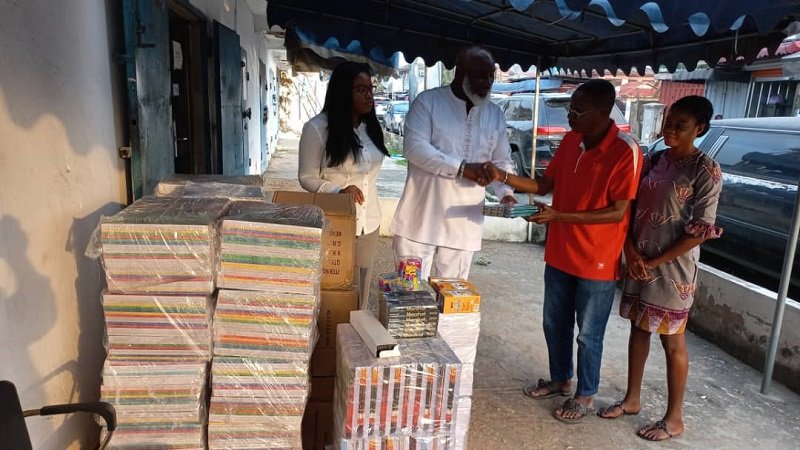 • Nii Abbey (second left) presenting the materials to Ataa Lartey