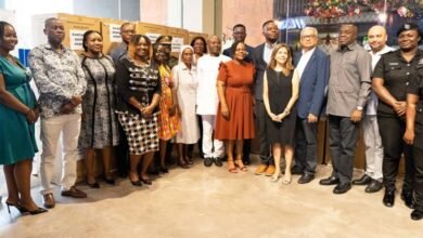 • The beneficiaries with MELCOM officials. (Inset)The medical items