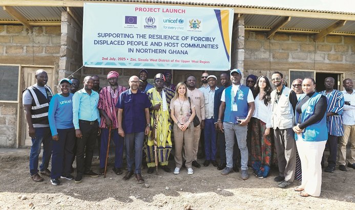 • Dignitaries infront of the yet to be completed refugee shelter in Zini, Upper West Region.