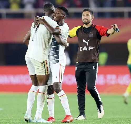 • Uganda players and an official celebrating their quaification