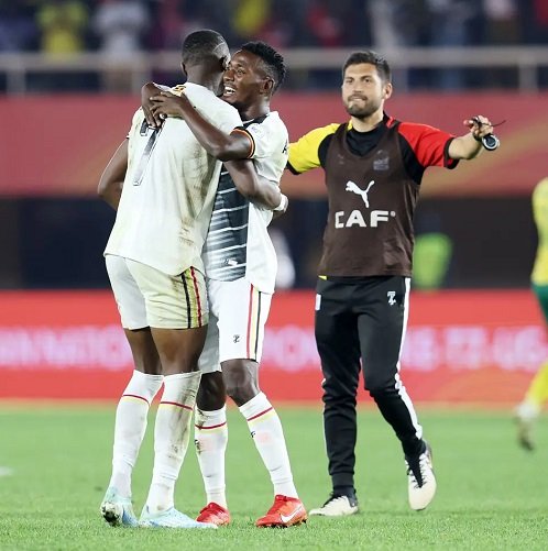 • Uganda players and an official celebrating their quaification