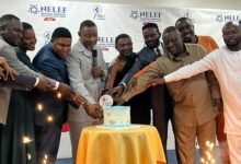 • Mr Asomani (third from left) and Rev. Tetteh (fourth from left) with other dignitaries cutting cake to launch the forum