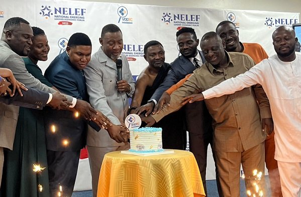 • Mr Asomani (third from left) and Rev. Tetteh (fourth from left) with other dignitaries cutting cake to launch the forum