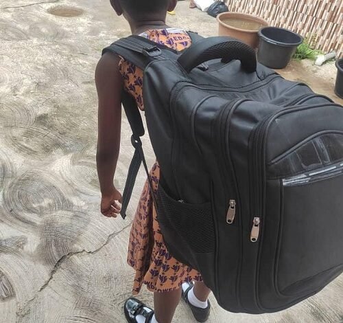 • A girl with a heavy school bag
