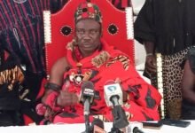 Osaberima Asumaning I (middle) speaking at the programme..