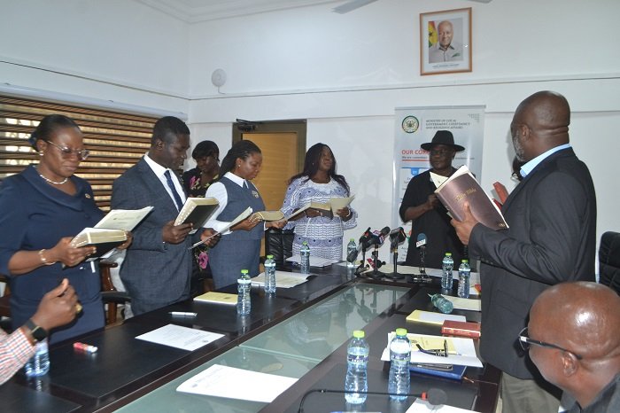 • Mr Ibrahim (second from right) swearing in the Board members. With him is Ms Rita Naa Odoley Sowah (fourth from left) Photo: Victor A. Buxton