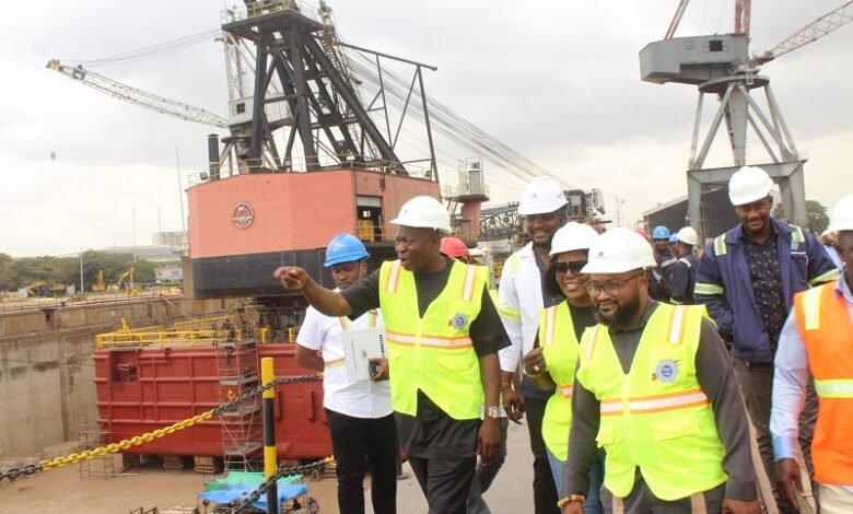 Alhaji Osman Sulemana (hand stretched), CEO Tema Shipyard, briefing Ms Dorcas Affo-Toffey (middle) during her visit to the Tema Shipyard comapany Photo: Ebo Gorman