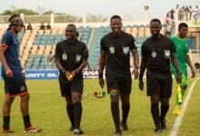 Assistant referee Roland Nii Addy (left) with Daniel Laryea and Kwasi Brobbey