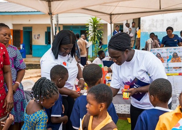 • Health officials with children during the screening exercise