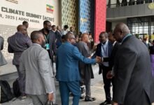 • Mr Seidu Issifu (middle) interacting with some participants at the summit