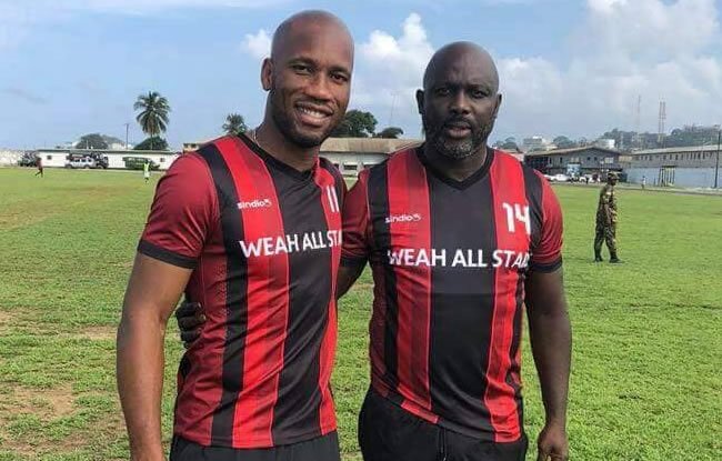 • Didier Drogba (left) with George Weah