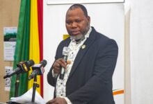 • Dr Jacob Paarechuga (inset), speaking at the lecture