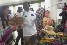 Mr Faidoo and Ms Severi (left) admiring art and crafts at the CNC stand at the exhibion