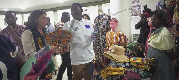 Mr Faidoo and Ms Severi (left) admiring art and crafts at the CNC stand at the exhibion