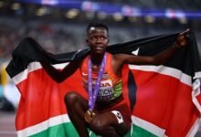 • Faith Cherotich celebrates after winning the gold medal