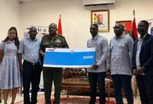 • Mr Achampong-Kyei (Right) presenting a dummy cheque to CDS Agyapong