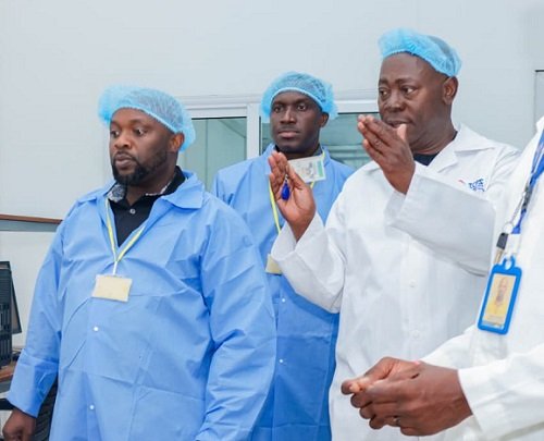 .Mr Blessed (infront) being conducted round