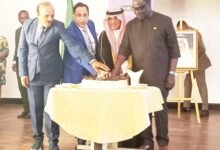• Ambassador Sultan Abdulrahman Al Dakhel (second from right), Mr James Gyakye Quayson (right) and other diplomats cutting a cake