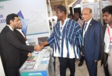 Govt to work with private ------Mr Harry Blemponny (in smock) and Mr Manish Gupta inspecting one of the exhibition stands. Photo. Ebo Gorman