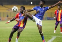 Hearts Mohammed Hussein battles for the ball with Richard Obeng (right)