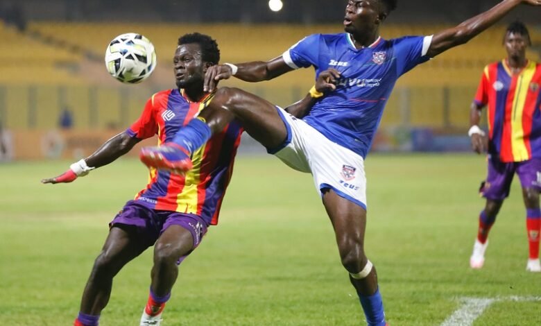 Hearts Mohammed Hussein battles for the ball with Richard Obeng (right)