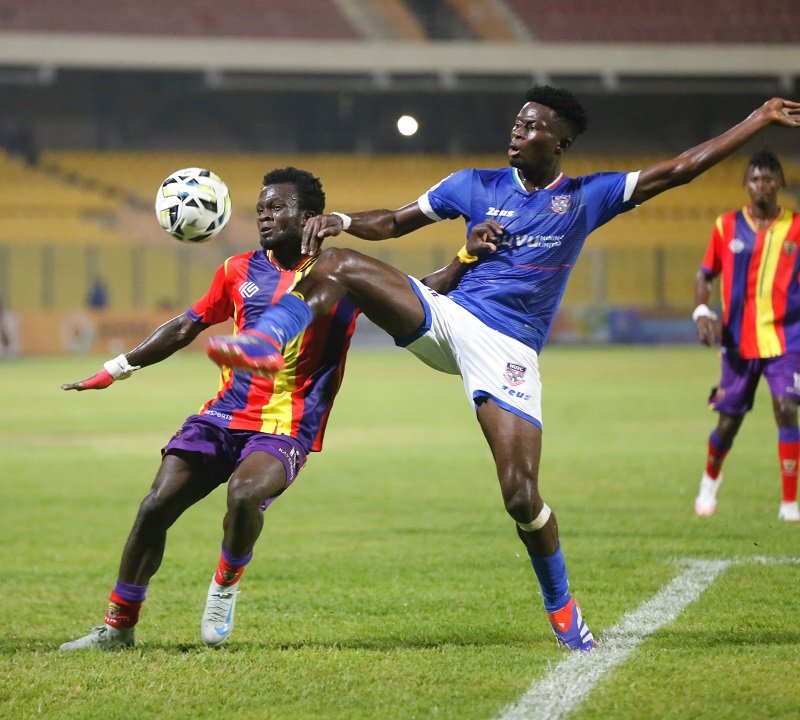 Hearts Mohammed Hussein battles for the ball with Richard Obeng (right)