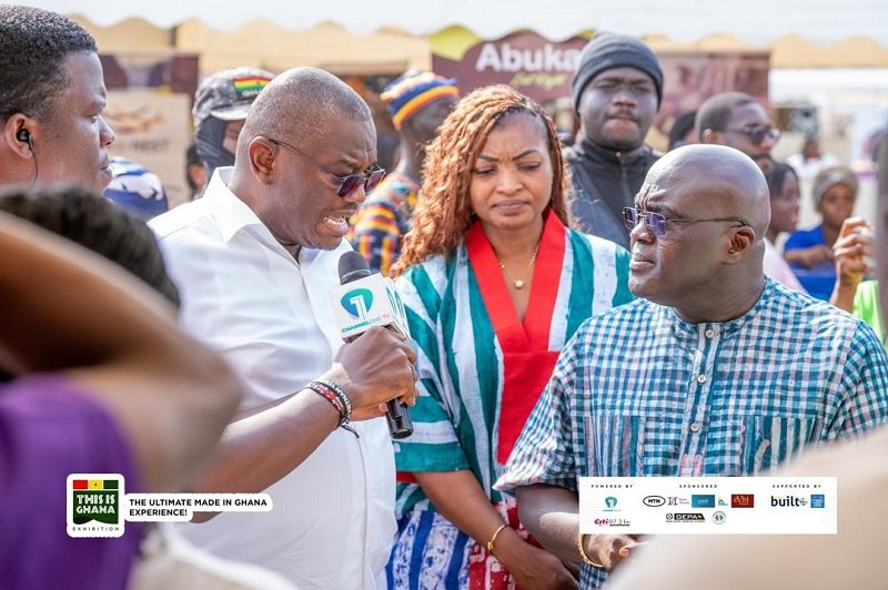 • Mr Debrah (right) being taken round the stands