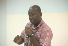 • Dr Paa Kwesi Baidoo (inset) addressing the staff