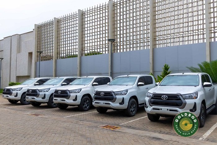• Mr Gyamfi (left) presenting a dummy cheque to Mr Buah