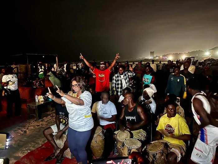 • Maame Efua Sekyi-Aidoo Houadjeto (standing in front) jubilating with some football fans after the match