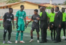Mr Okraku leads the player inspection exercise at one of the season opening games at the Tuba Park where Attram De Visser drew with Accra Lions