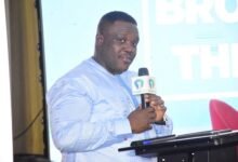 • Mr Sam George (inset) addressing the participants at the AMB conference.