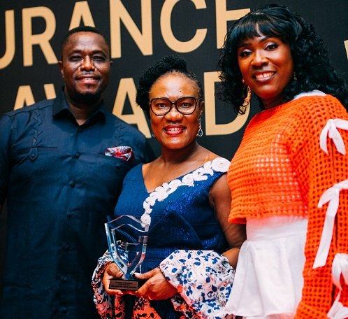 • Mrs Boampong (middle) displaying her award