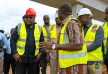 Inset: Mr Kwabena Bimpong (second from left) briefing President John Mahama on the state of work on the Ofankor-Nsawam road • Mr George (third from left) with other dignitaries launching the report at the summit Mr Seth Terkper addressing participants at the conference Photo: Ebo Gorman