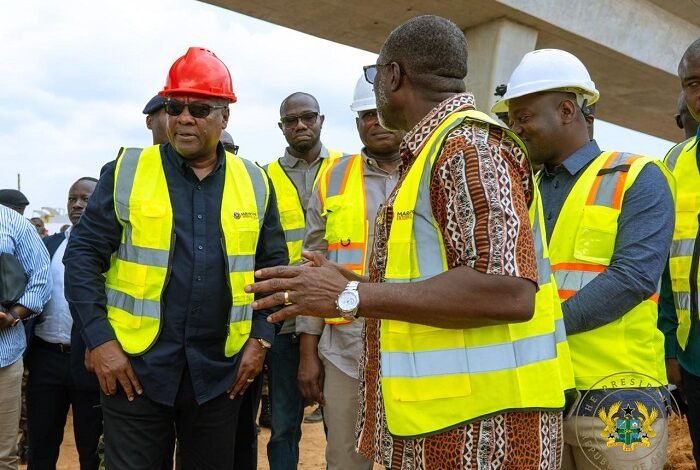 Inset: Mr Kwabena Bimpong (second from left) briefing President John Mahama on the state of work on the Ofankor-Nsawam road • Mr George (third from left) with other dignitaries launching the report at the summit Mr Seth Terkper addressing participants at the conference Photo: Ebo Gorman