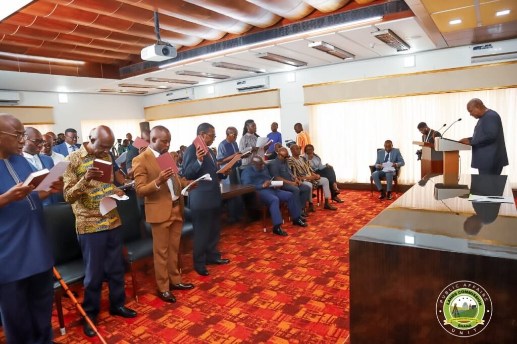 • President John Mahama swearing in the newly constituted Board of the Lands Commission