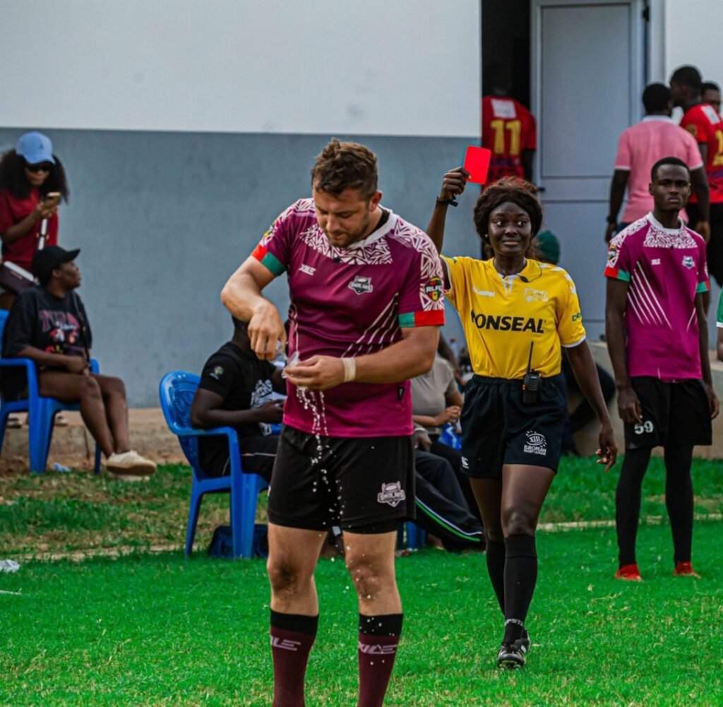 Referee Jacqueline Ansah shows a red card  to Abdulrahman Moussa being for unsporting behaviour