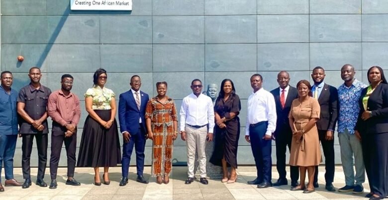 Mr Ackom (seventh from left) with other participants in the meeting