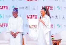Dr Oduwole displaying the IATF2027 flag