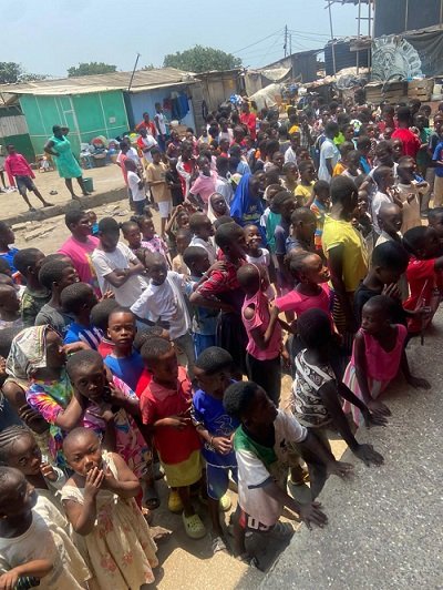 • Some of the children waiting to collect their parcels