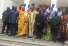 Togbe Afede XIV (third from left, front row) and Mr Courage Nunekpeku (second from left) with other officials