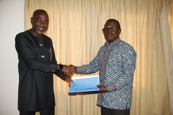 • Mr Martin Adu-Owusu (right) handing over the document to Prof. Kwamena Kwansah-Aidoo Photo: Elizabeth Okai
