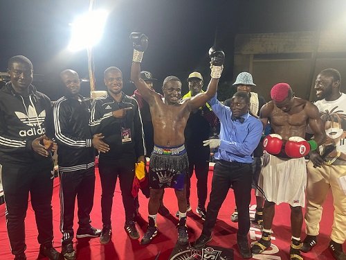 • Tagoe declared winner after the contest while his coaches and other admirers applaud