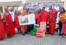 Mr Berko (fifth from left) presenting the items to Nana Akua Abookyi VI