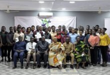 Dr Doku (third right) and other dignitaries in pose with beneficiaries
