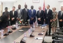 • Dr Forson (middle) with Mr John Humphrey (sixth from right) and other stakeholders after the signing ceremony